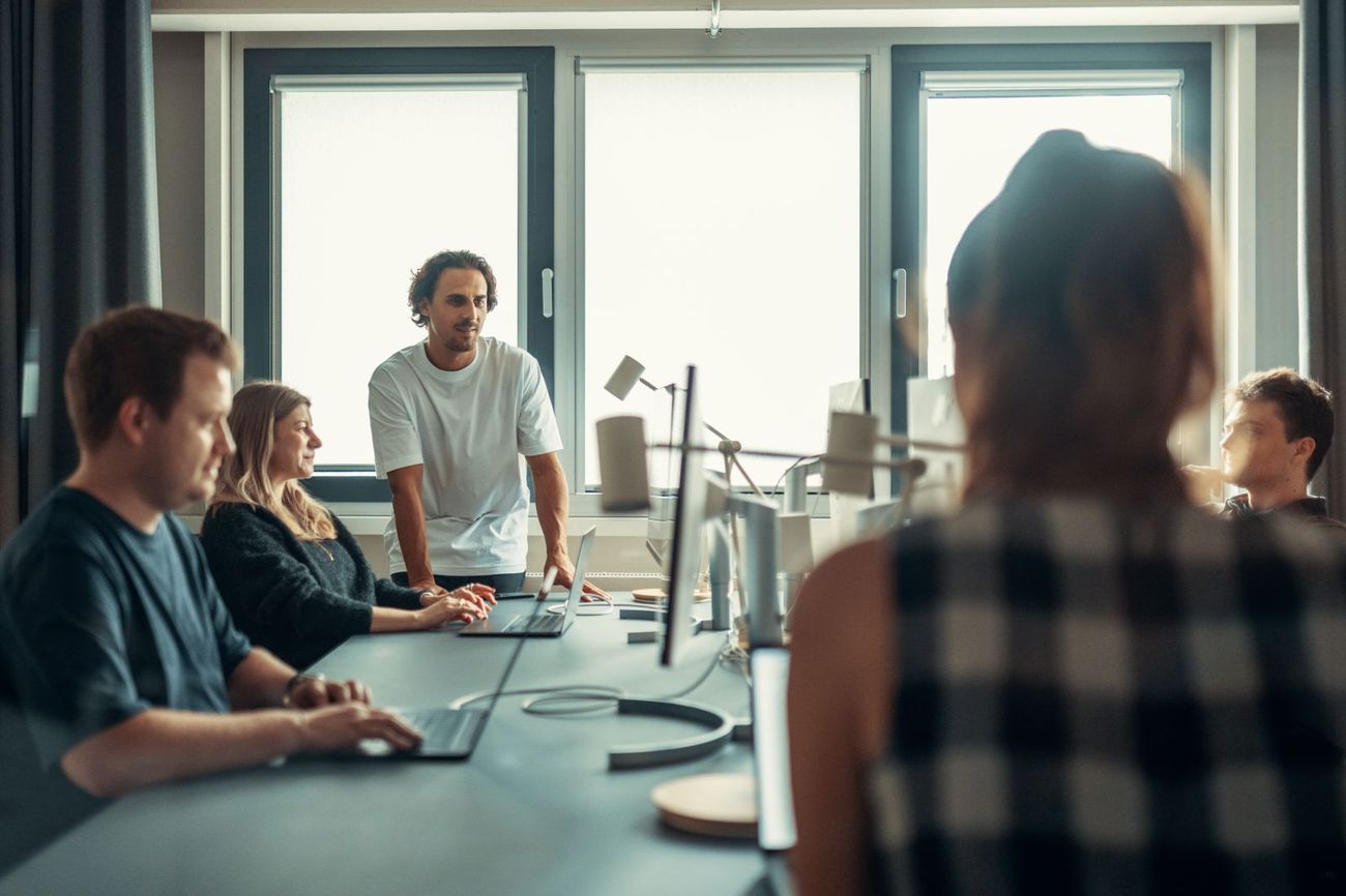 A team reviewing a project together at a meeting table